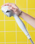 Handheld shower offers innovative palm feature Handheld shower offers innovative palm feature