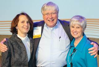 Outgoing and incoming LeadingAge leaders shown celebrating at the group’s recent convention include (L-R) Katie Smith Sloan, Larry Minnix and new board chairwoman Kathryn Roberts. Minnix officially st Outgoing and incoming LeadingAge leaders shown celebrating at the group’s recent convention include (L-R) Katie Smith Sloan, Larry Minnix and new board chairwoman Kathryn Roberts. Minnix officially st