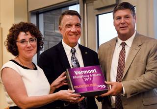 DAIL’s Monica Caserta Hutt and Secretary of Aging Services Al Gobeille presented the SCAN Foundation’s Pacesetter Prize to Gov. Phil Scott (R), center, in September. DAIL’s Monica Caserta Hutt and Secretary of Aging Services Al Gobeille presented the SCAN Foundation’s Pacesetter Prize to Gov. Phil Scott (R), center, in September.